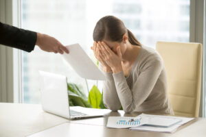 MaleHandGivesSadDepressedBusinesswomanDocumentWithBadNews