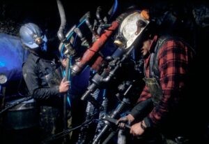 Two-Gold-Miners-On-Drill-at-Work-Gold-Mine-BC-Canada