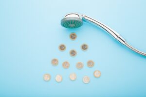 EuroCoinsAsDropsFallingFromShowerHeadOnLight