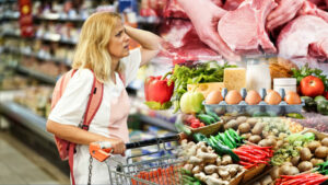 UpsetWomanInASupermarketWithAnEmptyShoppingTrolley