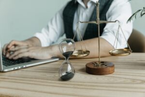 MaleLawyerWorkingWithContractPapersAndWoodenGavelOn