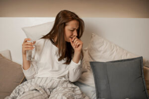 BeautifulGirlInCasualWearWithGlassOfWaterIn