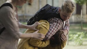 TwoStrongBoysBulliesBeatingWeakJuniorSchoolBoyPhysical