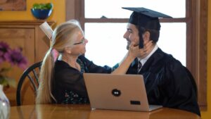 MotherAndSonSittingAtDiningRoomTableDoingOnline