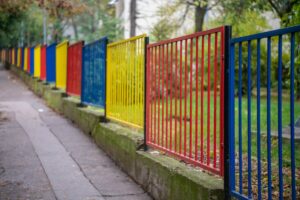 DecorativeMulticolorMetalFenceAtSchoolOrKindergartenPlayground