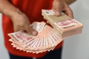 HandsHoldingPileOfMoney.SerbianDinarPaperCurrency1000