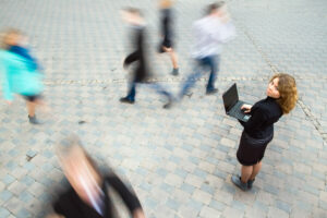 YoungAttractiveBusinesswomanWorkingOnLaptopThroughWirelessTechnology.Motion