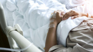 IllPatientLyingOnBedInHospital