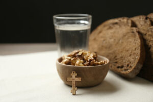 BreadWalnutsWaterAndCrucifixOnTable.GreatLentSeason