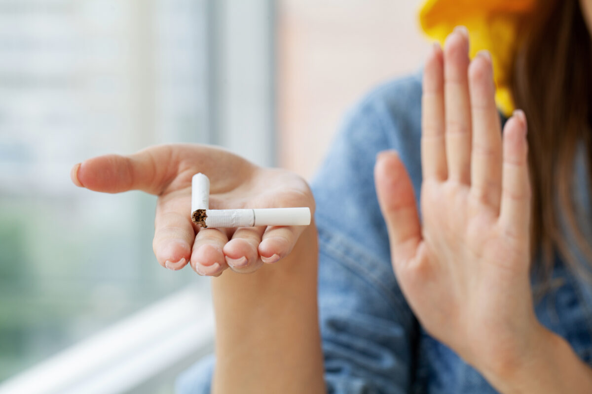 Stop-smoking-close-up-of-woman-breaking-cigarette