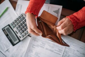 The,Hands,Of,An,Elderly,Woman,With,An,Empty,Wallet