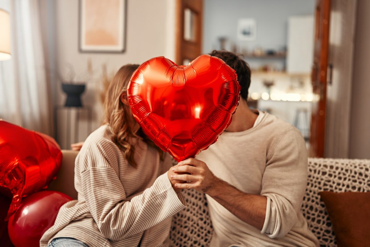 Happy,Valentine's,Day.,Young,Couple,In,Love,Holding,A,Heart-shaped