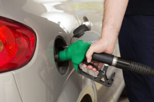 Handle,Fuel,Nozzle,To,Refuel.,Vehicle,Fueling,Facility.