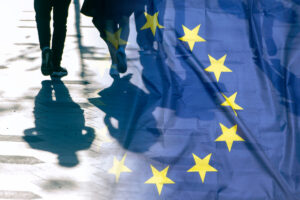Eu,Or,European,Union,Flag,And,Shadows,Of,People,,Concept