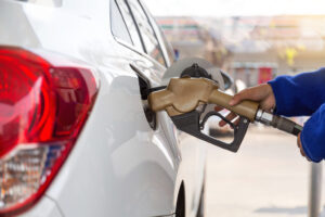 Pumping,Gasoline,Fuel,In,Car,At,Gas,Station.concept,Travel,And